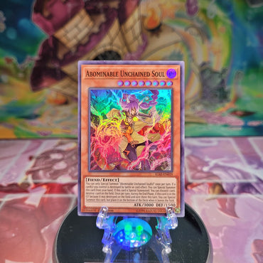  A Super Rare "Abominable Unchained Soul" card from the Yugioh Set: Ignition Assault.