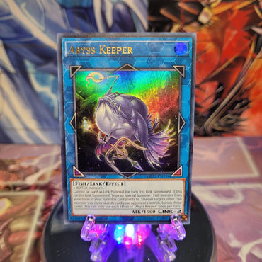 An Ultra Rare "Abyss Keeper" card from the Yugioh 2022 Tin of the Pharaoh's Gods Set (MP22).