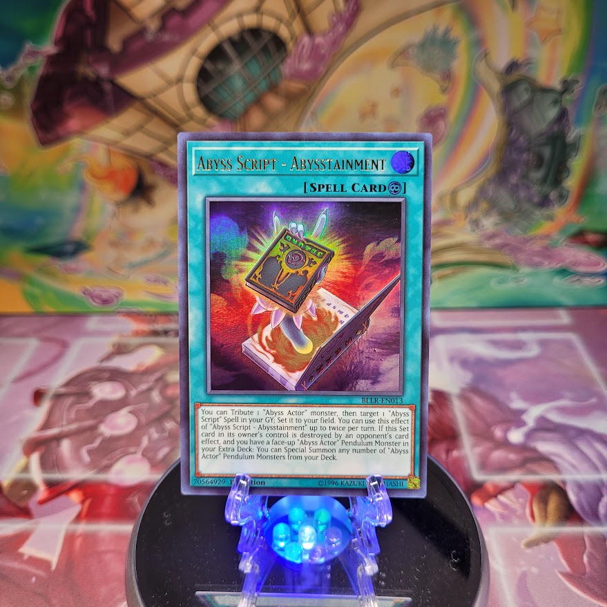  An Ultra Rare "Abyss Script - Abysstainment" card from the Yugioh Set: Battles of Legend: Light's Revenge.