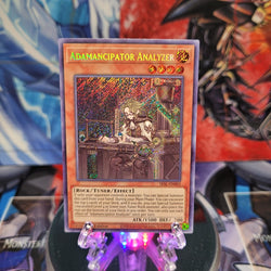  A Secret Rare "Adamancipator Analyzer" card from the Yugioh Set: Secret Slayers.