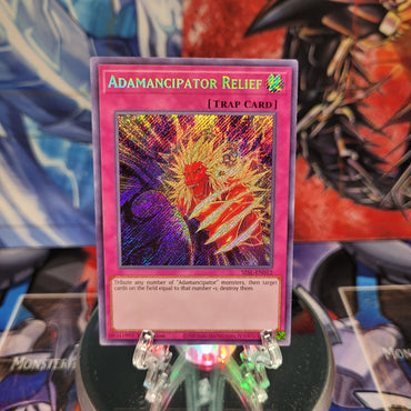  A Secret Rare "Adamancipator Relief" card from the Yugioh Set: Secret Slayers.