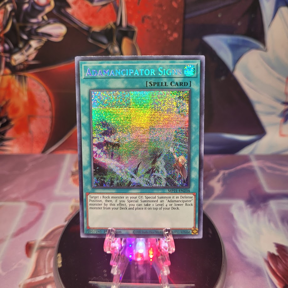  A Prismatic Secret Rare "Adamancipator Signs" card from the Yugioh 2021 Tin of Lost Memories.