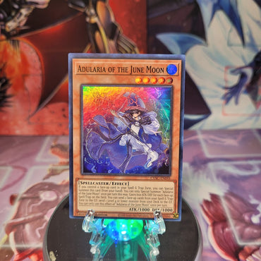 A Super Rare "Adularia of the June Moon" card from the Yugioh Set: Cyberstorm Access.