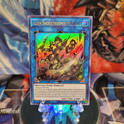  An Ultra Rare "Alien Shocktrooper M-Frame" card from the Yugioh Set: Duel Overload.