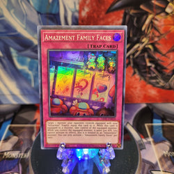 A Super Rare "Amazement Family Faces" card from the Yugioh Set: Dawn of Majesty.