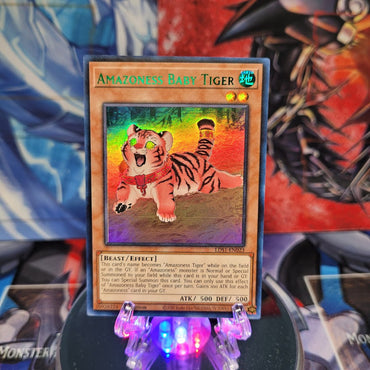 An Ultra Rare Green "Amazoness Baby Tiger" card from the Yugioh Set: Legendary Duelists: Season 1.