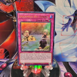 An Ultra Rare "Amazoness Hot Spring" card from the Yugioh Set: Battles of Legend: Crystal Revenge.