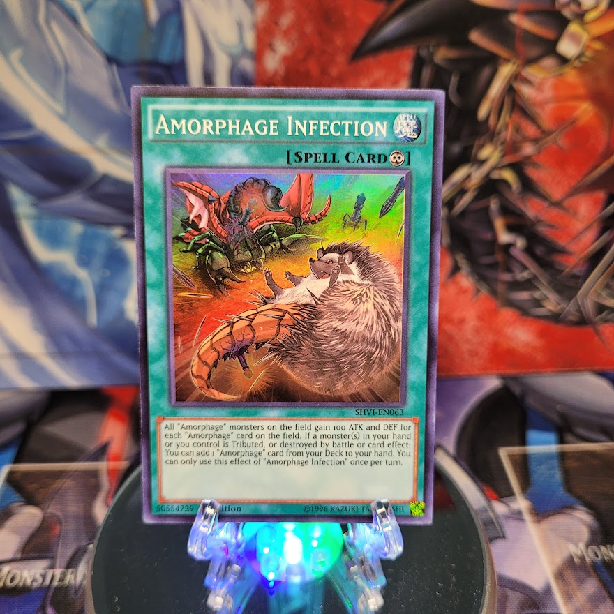 A Super Rare "Amorphage Infection" card from the Yugioh Set: Shining Victories.