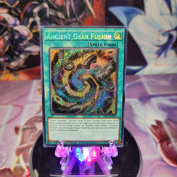 A Secret Rare "Ancient Gear Fusion" card from the Yugioh Set: Legendary Duelists: Season 1.