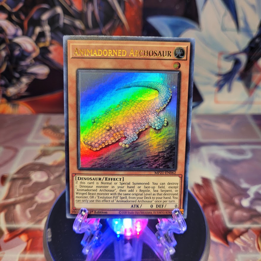 An Ultra Rare "Animadorned Archosaur" card from the Yugioh 2021 Tin of Ancient Battles (MP21).