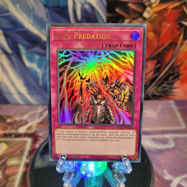 An Ultra Rare "Apex Predation" card from the Yugioh 2022 Tin of the Pharaoh's Gods Set.