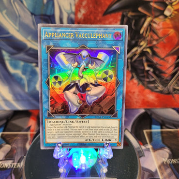 An Ultra Rare "Appliancer Vacculephant" card from the Yugioh Set: Battles of Legend: Armageddon.