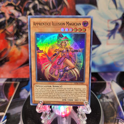 A Super Rare "Apprentice Illusion Magician" card from the Yugioh Set: Legendary Duelists: Magical Hero.