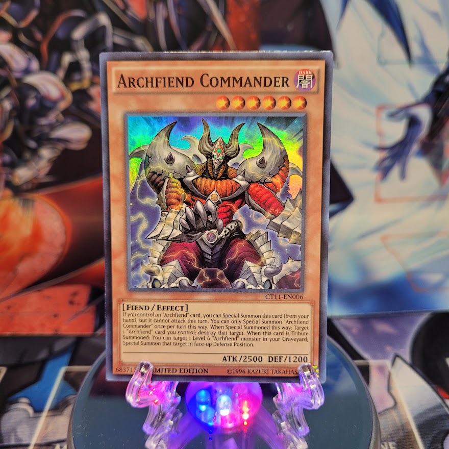 A Super Rare "Archfiend Commander" card from the Yugioh 2014 Mega-Tins.