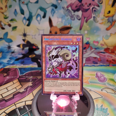 A Secret Rare "Archfiend Hieress" card from the Yugioh Set: Maze of Muertos (MZMU).