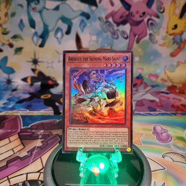 A Super Rare "Arequus the Shining Mars Saint" card from the Yugioh Set: Maze of Muertos (MZMU).