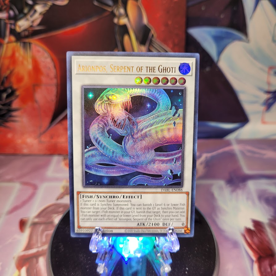 An Ultra Rare "Arionpos, Serpent of the Ghoti" card from the Yugioh Set: Darkwing Blast.