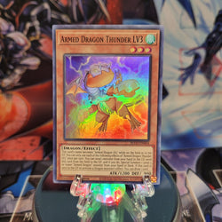 A Super Rare "Armed Dragon Thunder LV3" card from the Yugioh Set: Blazing Vortex.