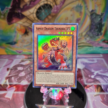 A Super Rare "Armed Dragon Thunder LV3" card from the Yugioh Set: Blazing Vortex.