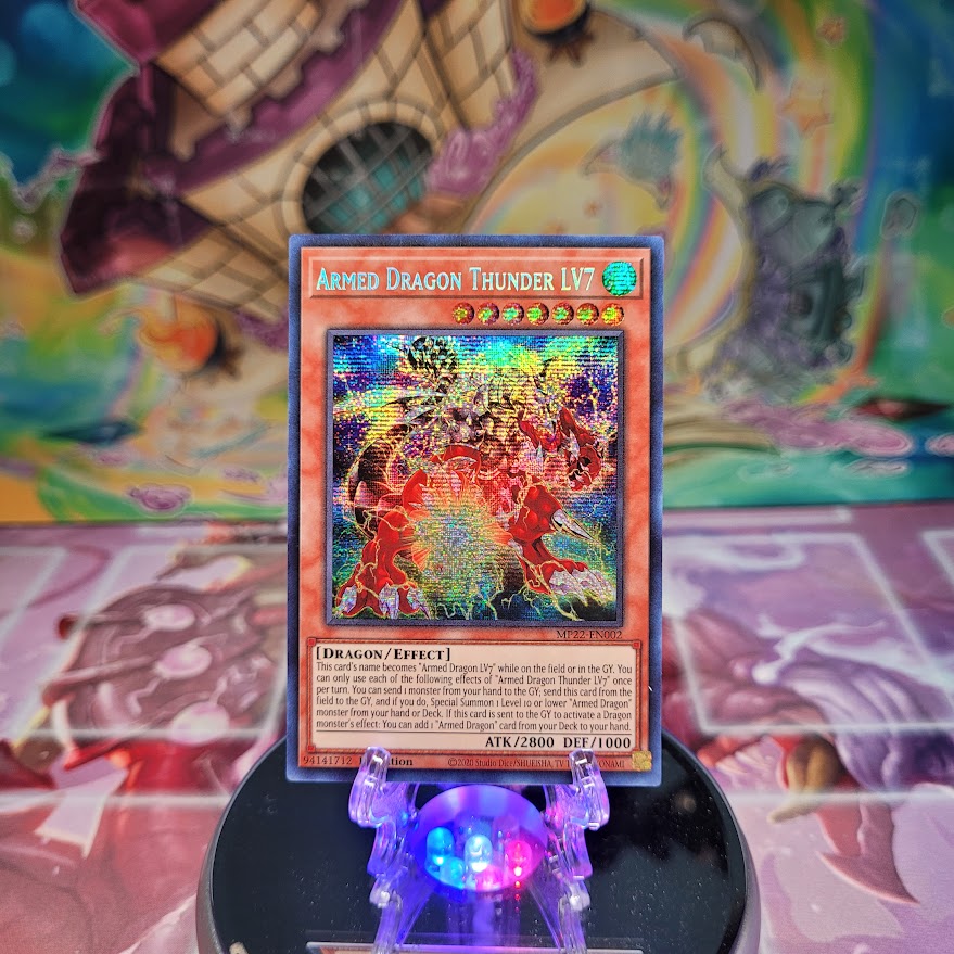 A Prismatic Secret Rare "Armed Dragon Thunder LV7" card from the Yugioh 2022 Tin of the Pharaoh's Gods set (MP22).