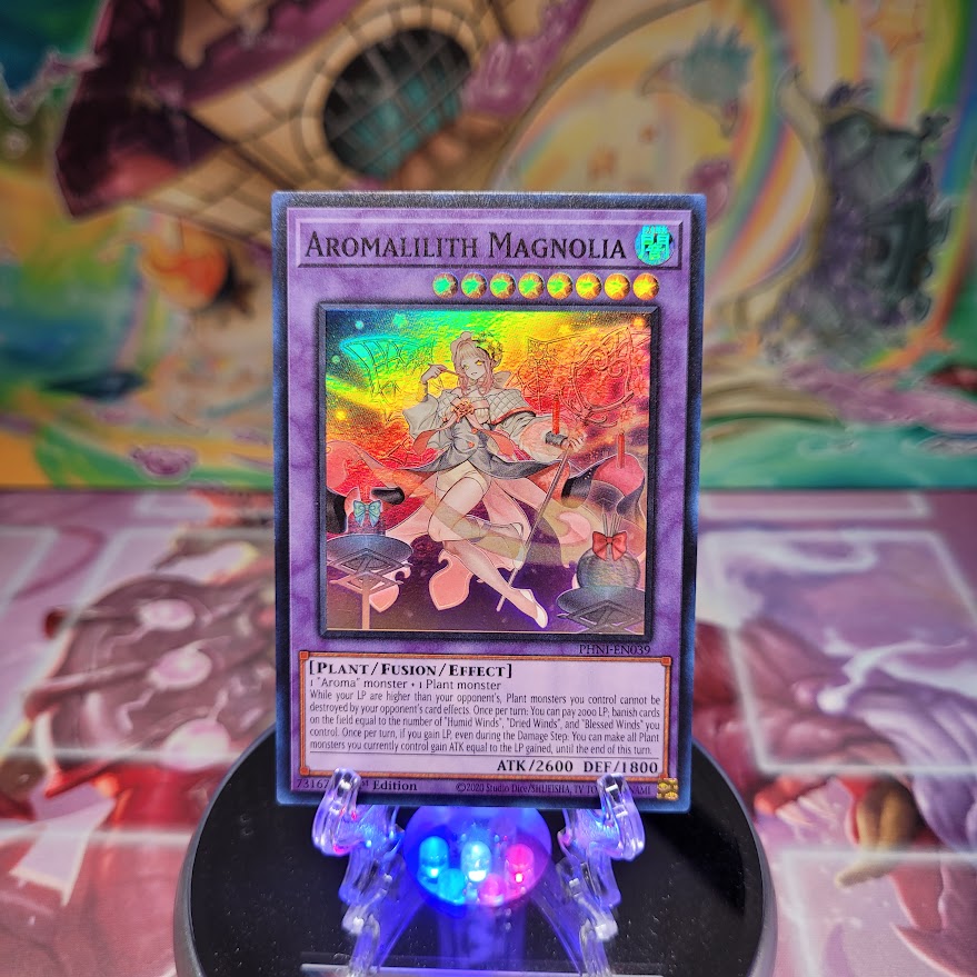 A Super Rare "Aromalilith Magnolia" card from the Yugioh Set: Phantom Nightmare.