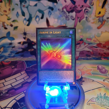 An Ultra Rare "Arrive in Light" card from the Yugioh Set: Battles of Legend: Glorious Gallery (BLGG).