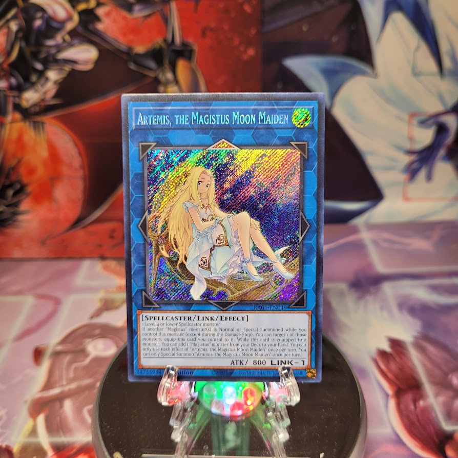 A Secret Rare "Artemis, the Magistus Moon Maiden" card from the Yugioh Set: Rarity Collection 1 (RA01).