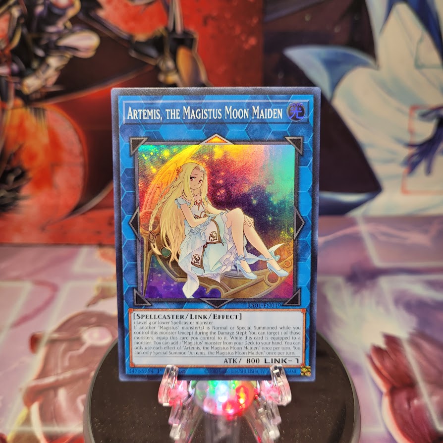 A Super Rare "Artemis, the Magistus Moon Maiden" card from the Yugioh Set: Rarity Collection 1 (RA01).