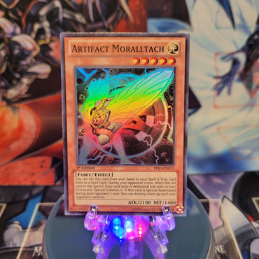 A Super Rare "Artifact Moralltach" card from the Yugioh Set: Primal Origin.