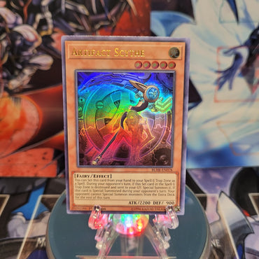 An Ultra Rare "Artifact Scythe" card from the Yugioh Set: Battles of Legend: Hero's Revenge.