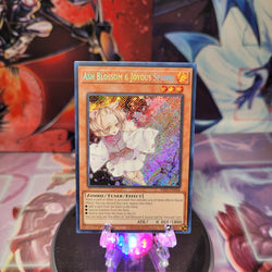 A Secret Rare "Ash Blossom & Joyous Spring" card from the Yugioh Set: Rarity Collection 1 (RA01).