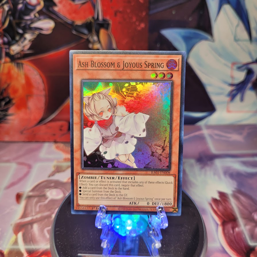 A Super Rare "Ash Blossom & Joyous Spring" card from the Yugioh Set: Rarity Collection 1 (RA01).