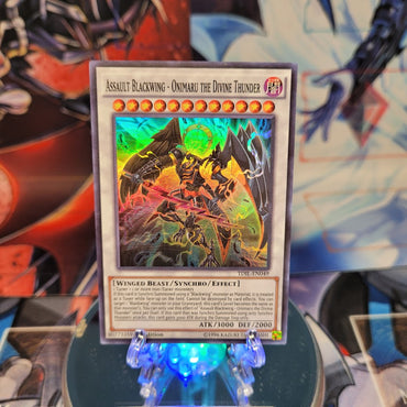 A Super Rare "Assault Blackwing - Onimaru the Divine Thunder" card from the Yugioh set: The Dark Illusion.