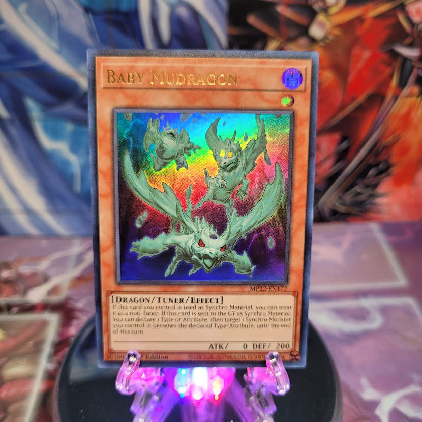 An Ultra Rare "Baby Mudragon" card from the Yugioh 2022 Tin of the Pharaoh's Gods Set.