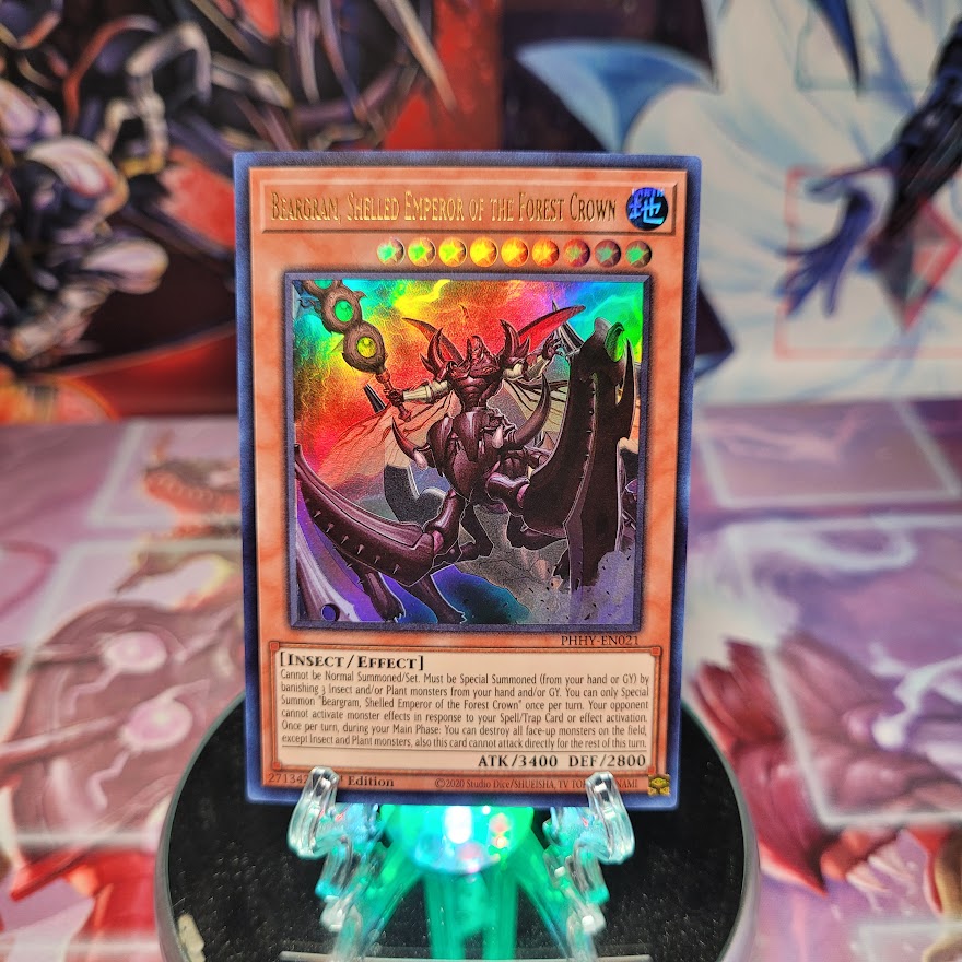 An Ultra Rare "Beargram, Shelled Emperor of the Forest Crown" card from the Yugioh Set: Photon Hypernova (PHHY).