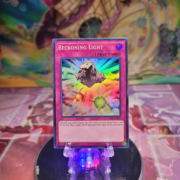 A 1st edition Super Rare "Beckoning Light" card from the Yugioh Set: Spirit Warriors.