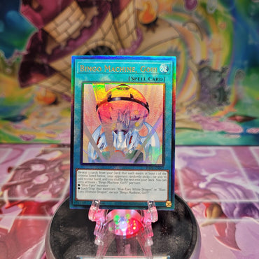 A Prismatic Ultimate Rare "Bingo Machine, Go!!!" card from the Yugioh Set: Rarity Collection 2 (RA02).