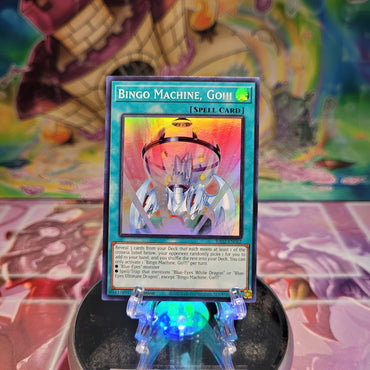 A Super Rare "Bingo Machine, Go!!!" card from the Yugioh Set: Rarity Collection 2 (RA02).