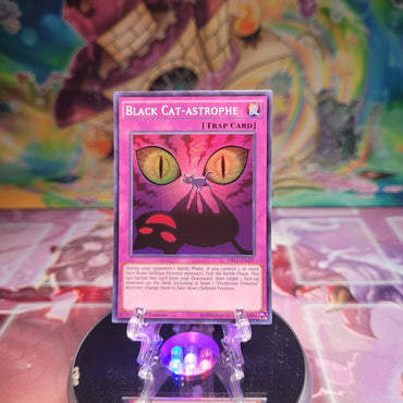 A Super Rare "Black Cat-astrophe" card from the Yugioh Set: Dragons of Legend 2.