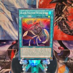 A Super Rare "Black Feather Whirlwind" card from the Yugioh Set: Darkwing Blast.