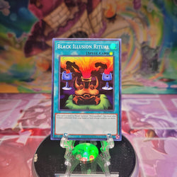 A Super Rare "Black Illusion Ritual" card from the Yugioh Set: Spell Ruler 25th Anniversary.