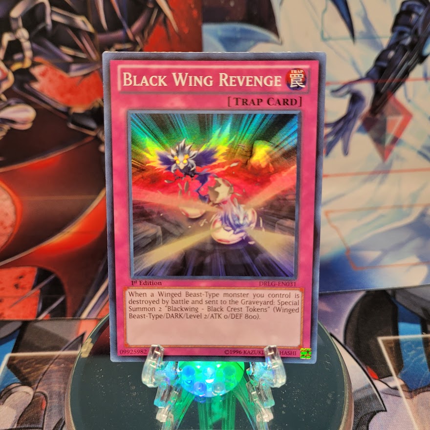 A Super Rare "Black Wing Revenge" card from the Yugioh set: Dragons of Legend.