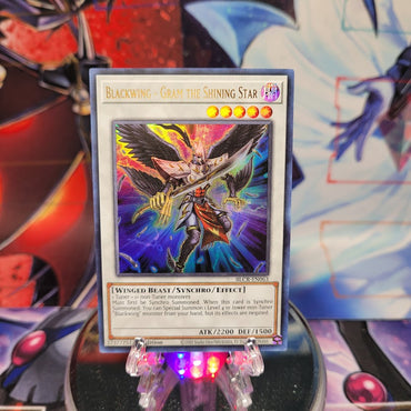 An Ultra Rare "Blackwing - Gram the Shining Star" card from the Yugioh Set: Battles of Legend: Crystal Revenge.