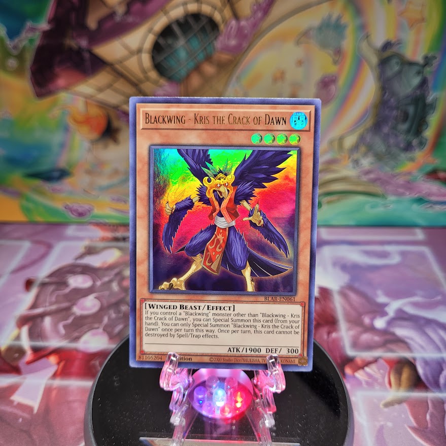 An Ultra Rare "Blackwing - Kris the Crack of Dawn" card from the Yugioh Set: Battles of Legend: Armageddon.