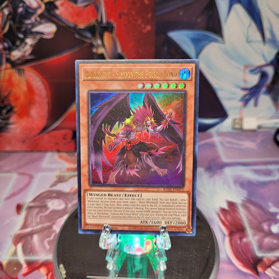An Ultra Rare "Blackwing - Simoon the Poison Wind" card from the Yugioh Set: Rarity Collection 1 (RA01).