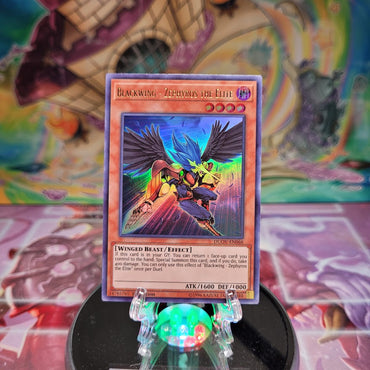 An Ultra Rare "Blackwing - Zephyros the Elite" card from the Yugioh Set: Duel Overload.