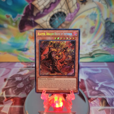  A Secret Rare "Blaster, Dragon Ruler of Infernos" card from the Yugioh Set: Quarter Century Bonanza (RA03).