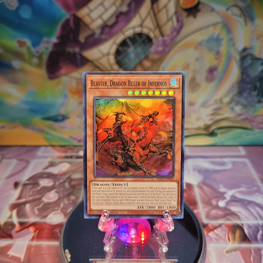 A Super Rare "Blaster, Dragon Ruler of Infernos" card from the Yugioh Set: Quarter Century Bonanza (RA03).