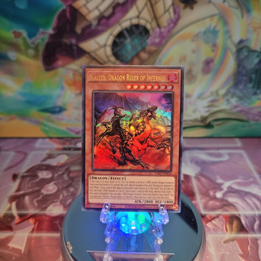 An Ultra Rare "Blaster, Dragon Ruler of Infernos" card from the Yugioh Set: Quarter Century Bonanza (RA03).