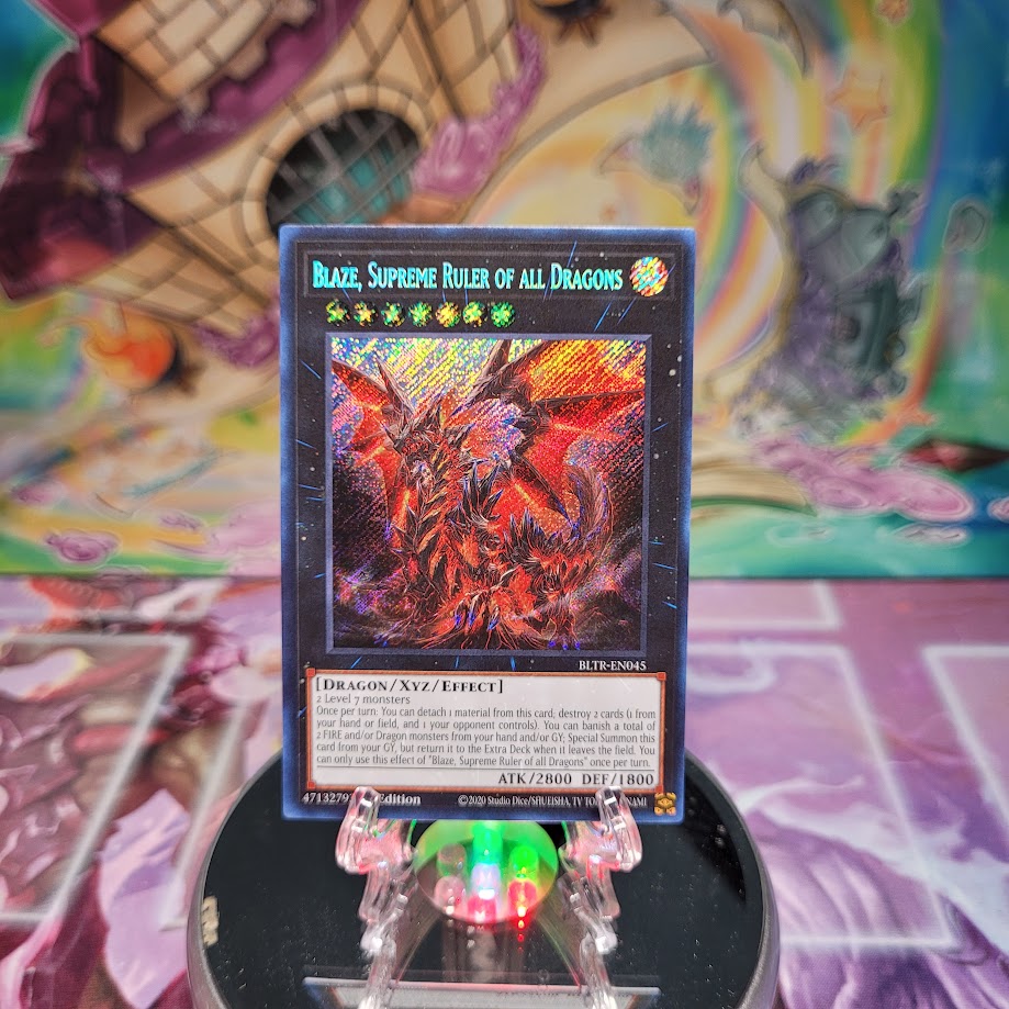 A Secret Rare "Blaze, Supreme Ruler of All Dragons" card from the Yugioh Set: Battles of Legend: Terminal Revenge.